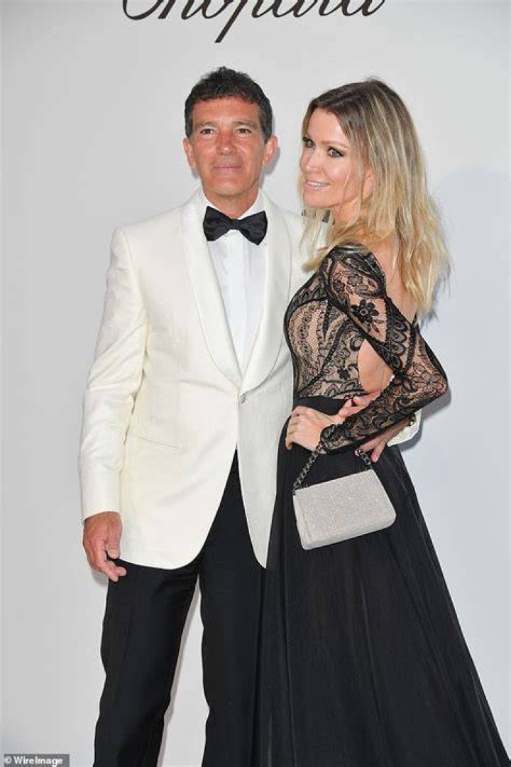 Antonio Banderas, 58, looks suave in a white tuxedo with glamorous