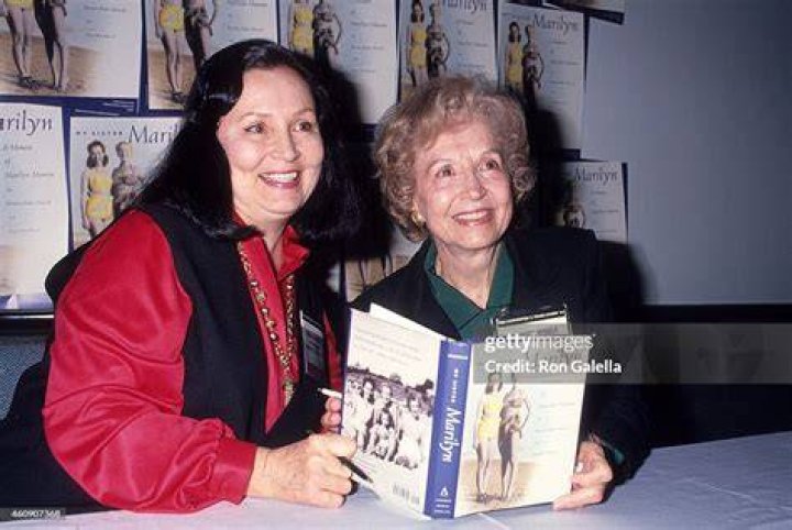 Berniece Baker Miracle in 1994 holding a photo of her halfsister