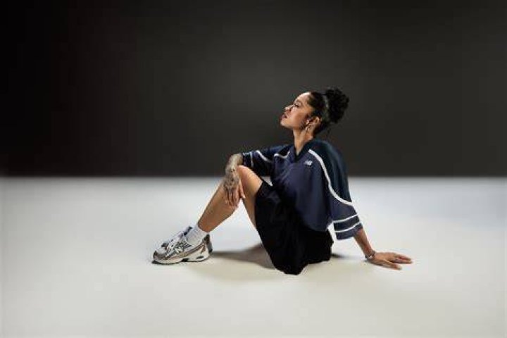 Ella Mai Steps Out With a SkyHigh Sculptural Bun at the Billboard