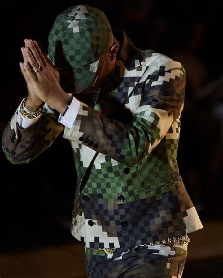pharrell williams debuts first louis vuitton men's collection against a