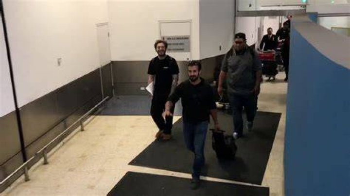 Post Malone touches down in Sydney with girlfriend and baby daughter